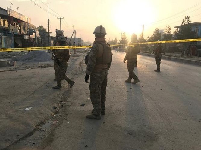 Bombs explode outside Afghan jail compound, police battle militants