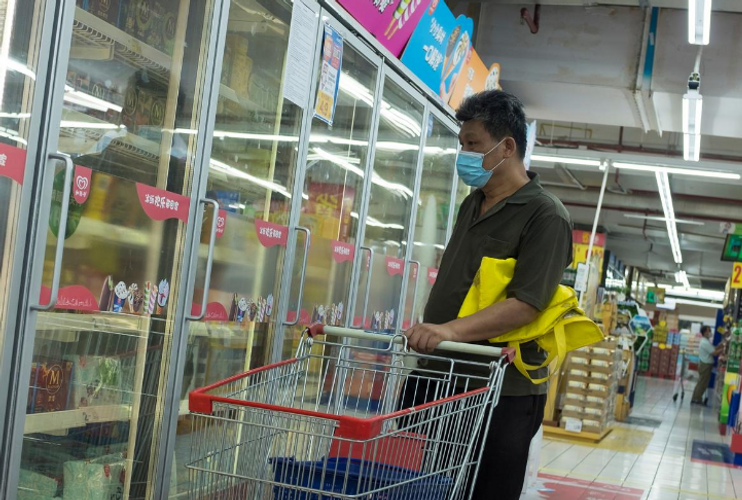 Chinese cities find coronavirus in frozen food imports, WHO downplays infection risk