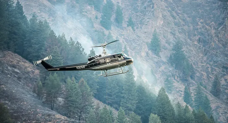 Pilot of helicopter crashed while fighting California wildfire dies