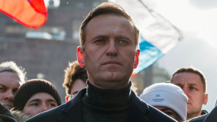 Navalny remains in medically induced coma in serious condition, no threat to his life, doctors say