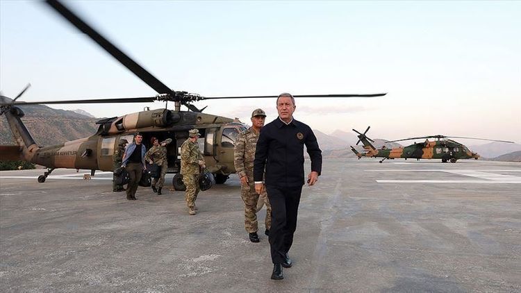 Turkish defense chief heading to Syria border