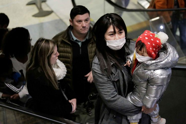 China asks low-risk coronavirus areas to resume visa, passport services