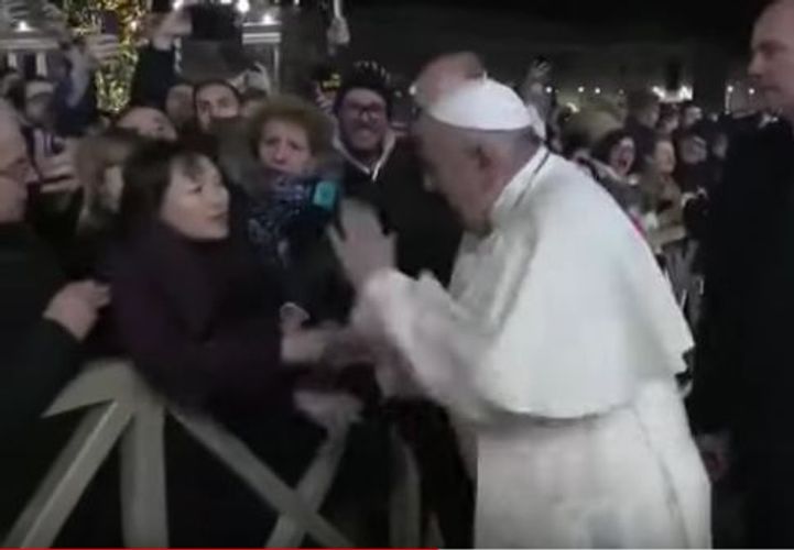 Pope Francis apologises after slapping hand of woman who grabbed him - VIDEO