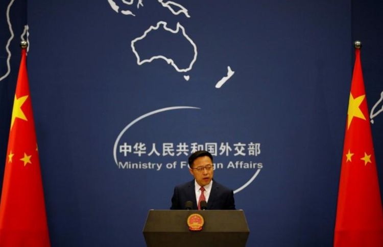 China rejects report that it delayed COVID-19 information sharing with WHO