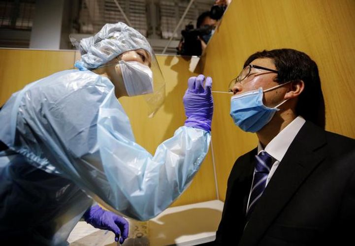 Japan opens airport coronavirus test lab for departing travellers