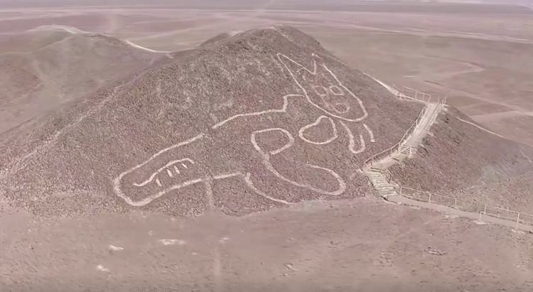 Peruvian archaeologists unveil giant cat carved into Nazca hillside