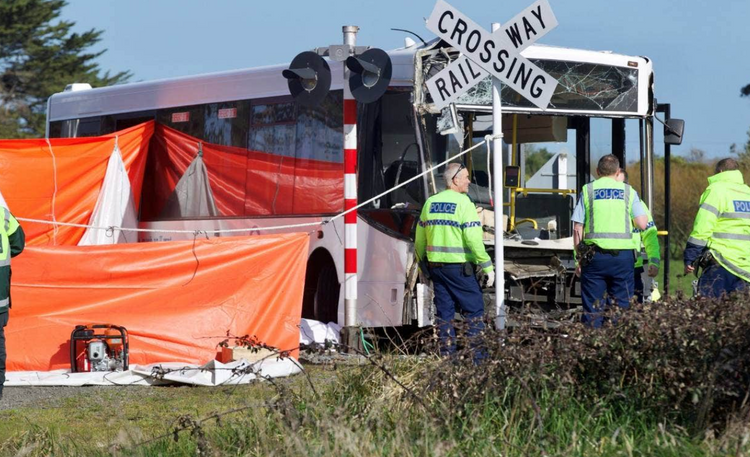 Dozens of children injured in New Zealand after school bus collides with train