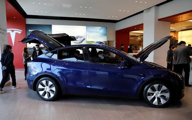 Tesla shares surge after electric carmaker posts record deliveries
