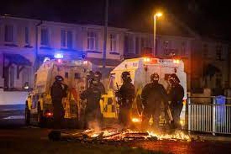 Police attacked during another night of violence