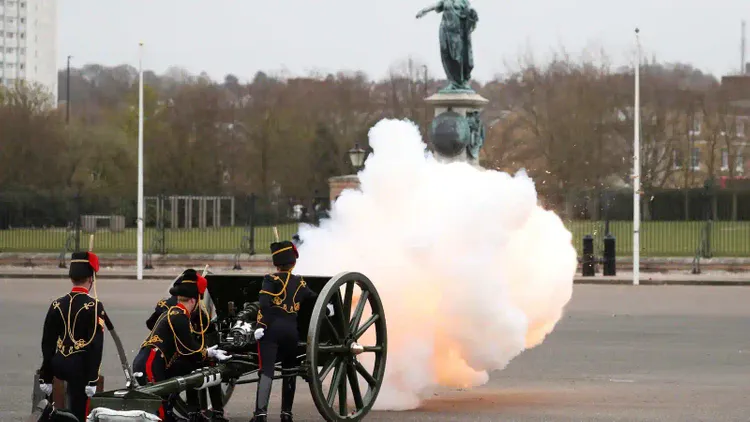 With artillery guns and flowers, Britain salutes Prince Philip