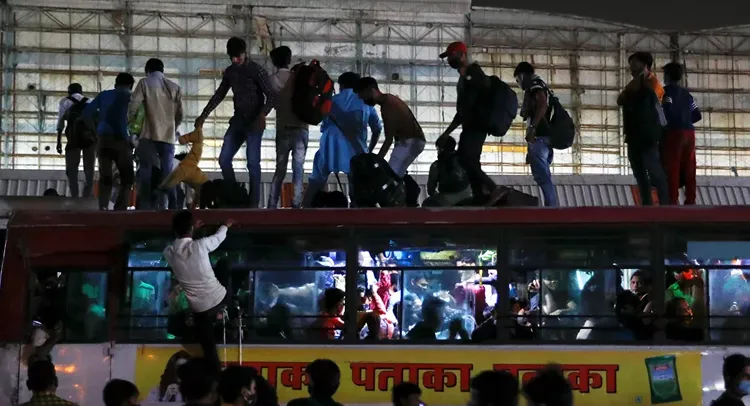 Two killed as bus overloaded with migrant workers overturns in India