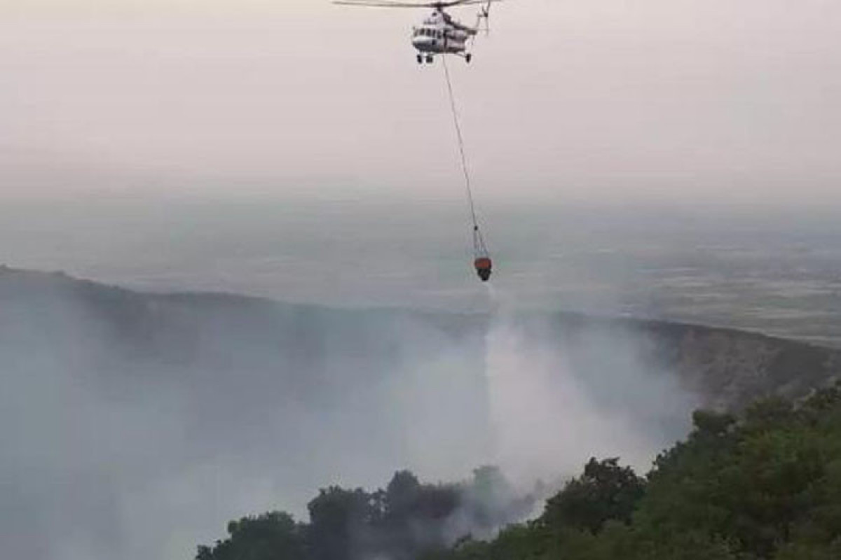 A helicopter involved in extinguishing fire in mountainous area of Azerbaijan