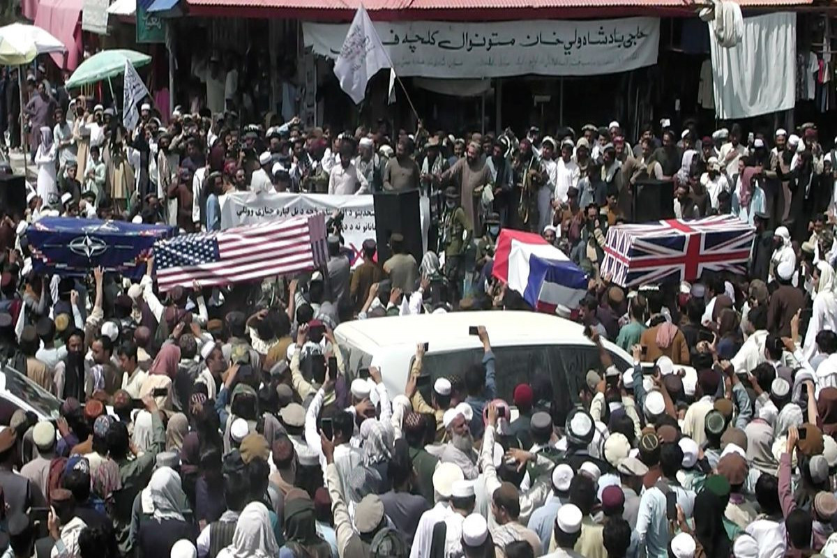 Taliban supporters hold mock U.S. funeral as troops leave Afghanistan