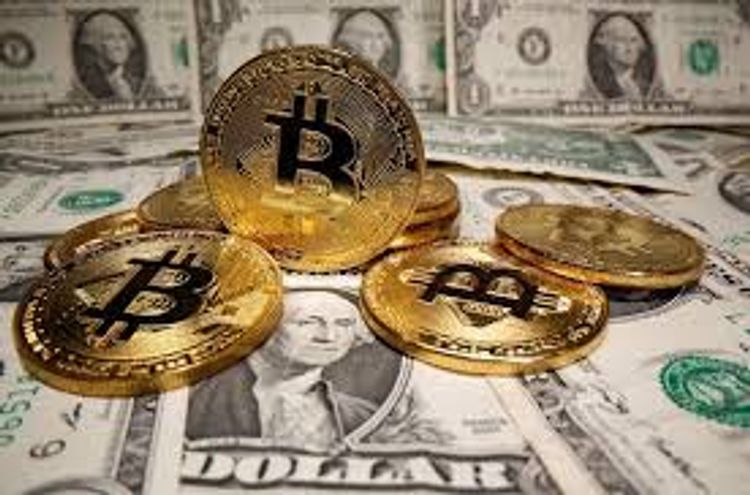 Dollar steadies on U.S. recovery hopes, Bitcoin near record $52,640