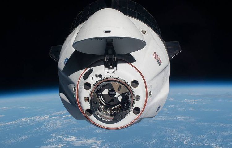 Crew Dragon spacecraft with four astronauts returns to Earth