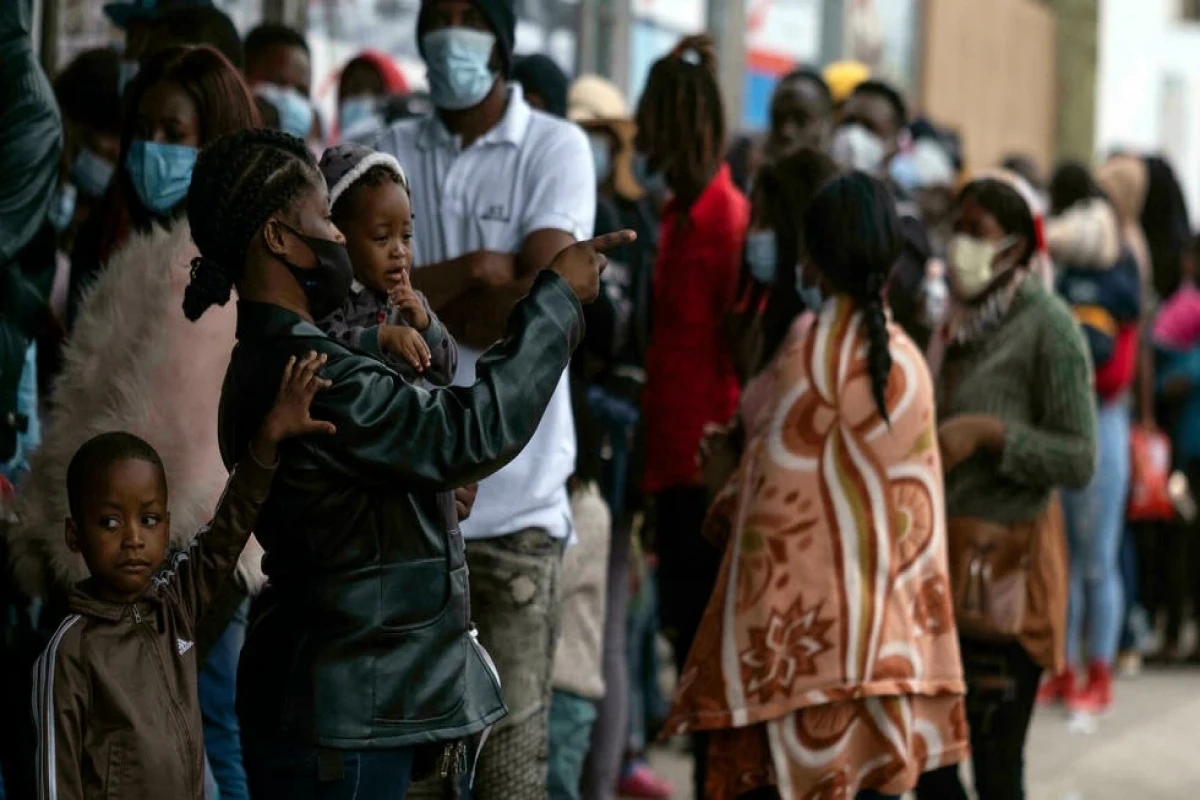 Haitian migrants queue in Tijuana, Mexico on October 6, 2021