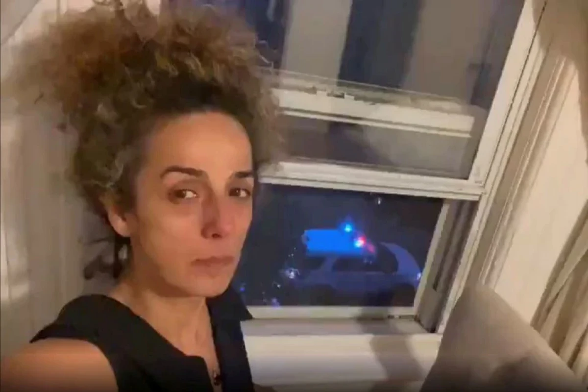 Iranian American journalist Alinejad Masih shows an FBI car guarding outside her apartment in this still image from an undated social media video posted on July 14, 2021.