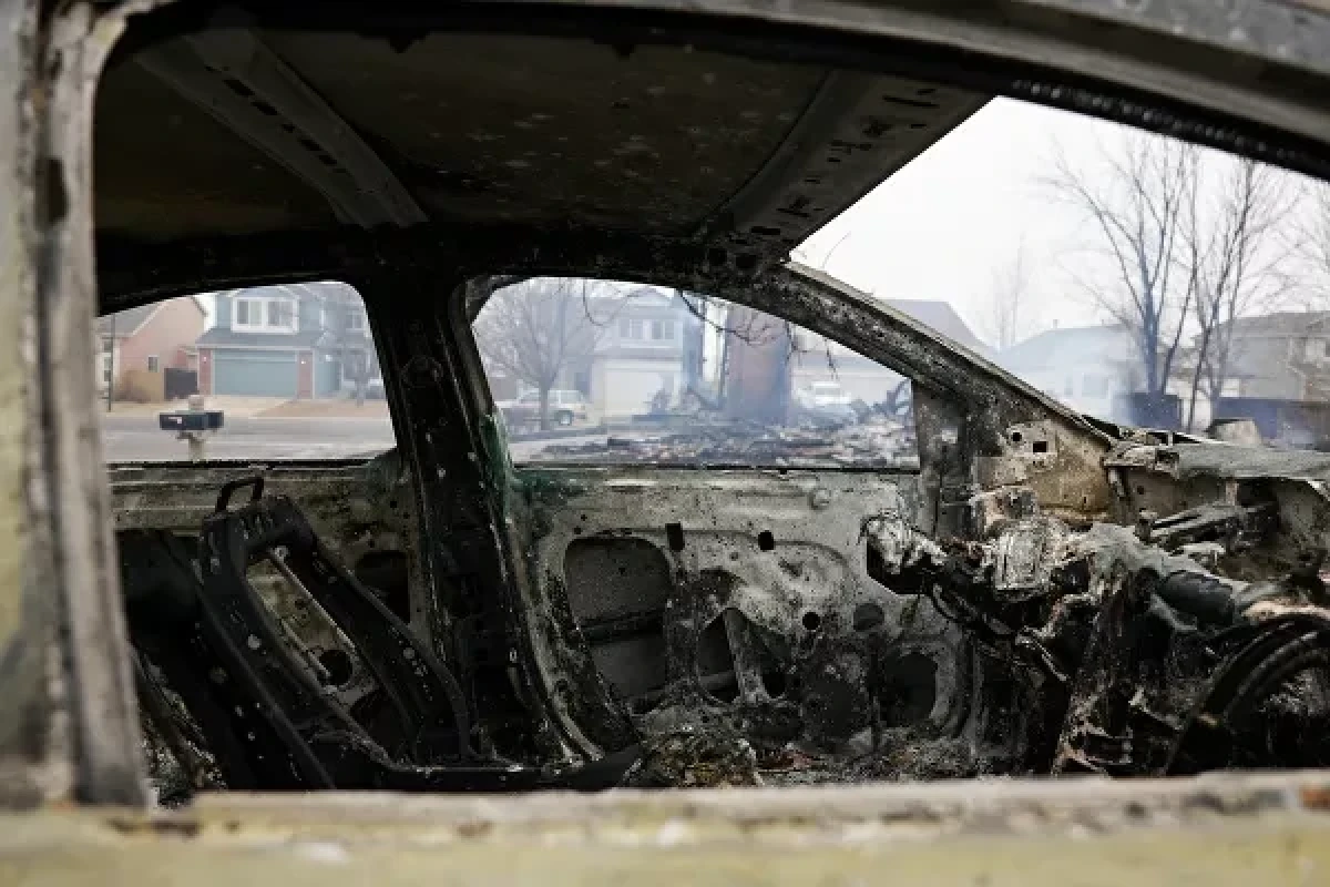 The interior of a damaged car is pictured, a day after wind-driven wildfires prompted evacuation orders, in Superior, Colorado, US 31 December 2021.