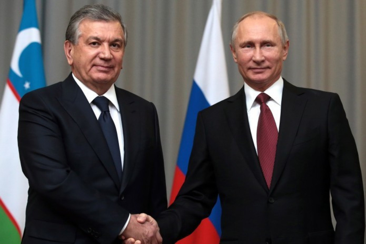 Russian President Vladimir Putin and  Uzbek President Shavkat Mirziyoyev