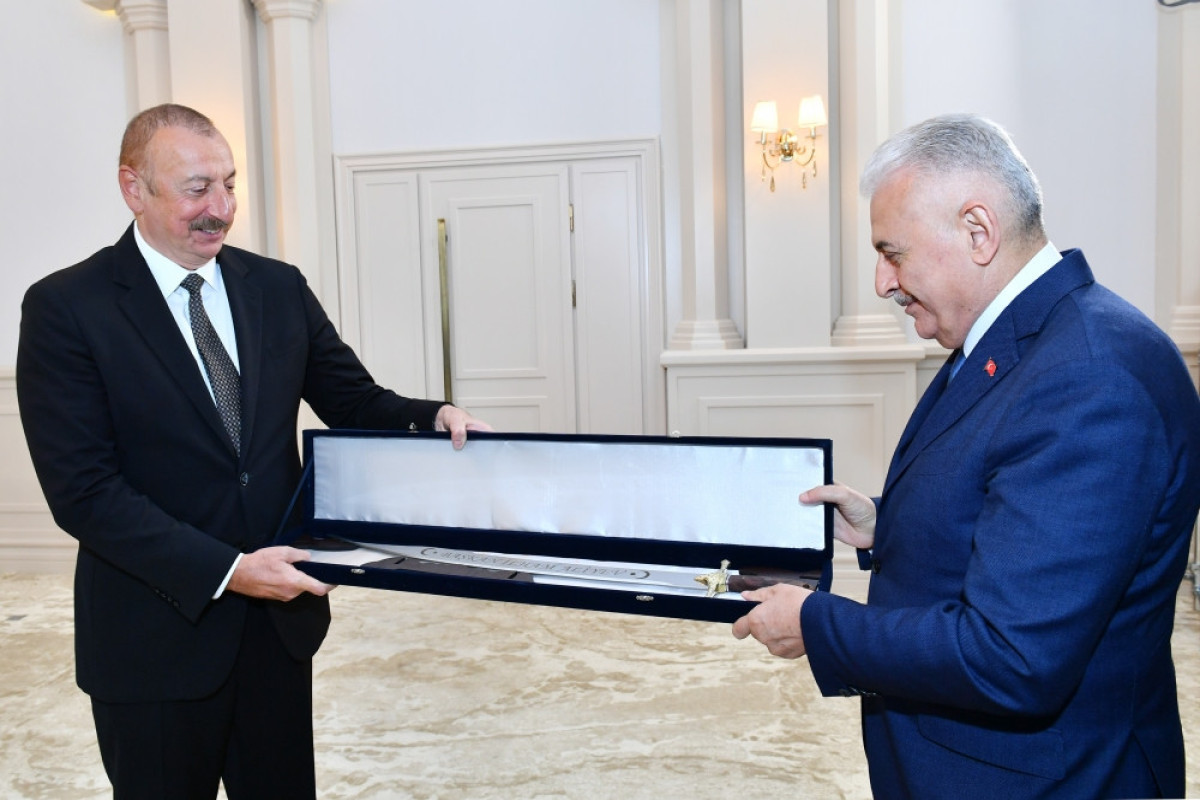 Binali Yildirim presents sword to President Ilham Aliyev the same as Fateh Sultan Mehmed