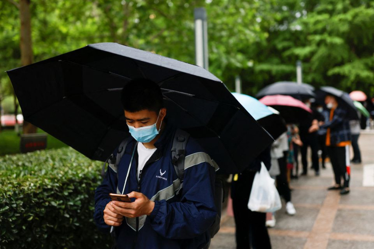 Beijing kicks off fresh round of COVID tests as Shanghai postpones crucial exams