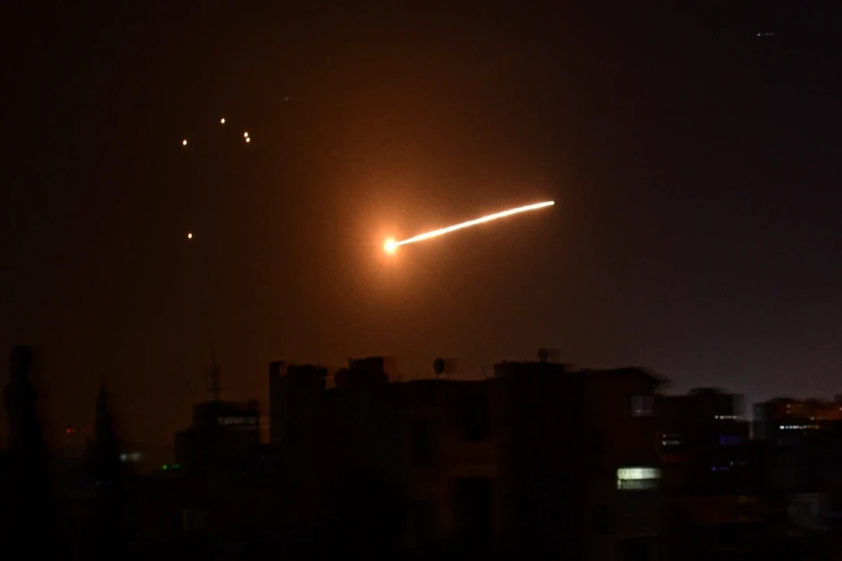Syrian air defenses down missiles in Damascus