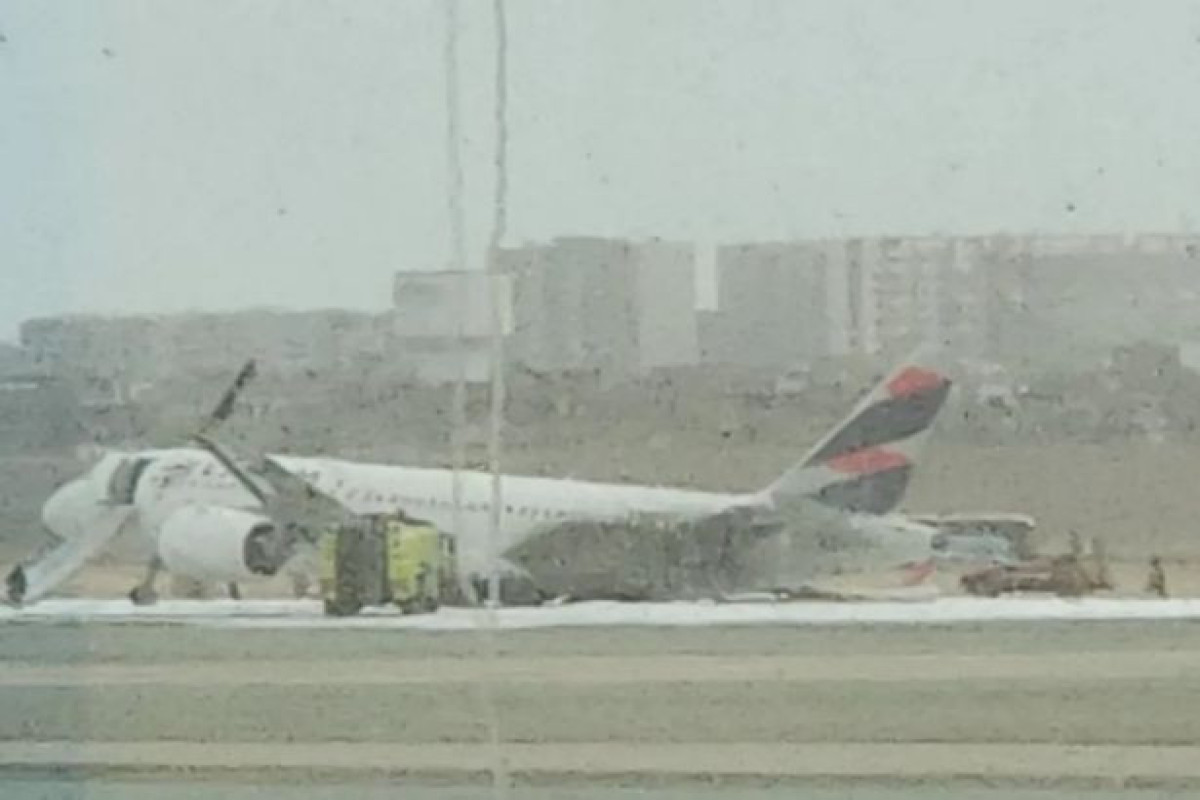 Passenger plane bursts into flames after 'colliding with truck' at airport-PHOTO 