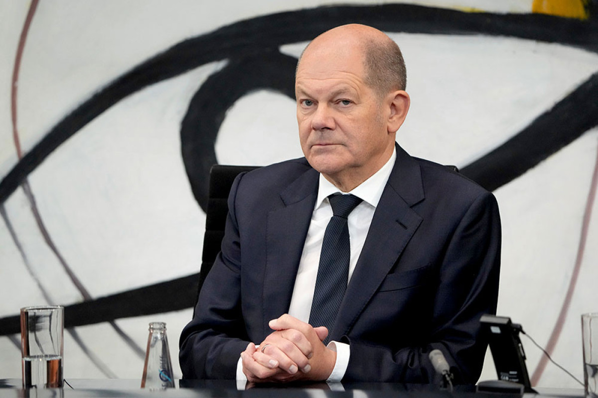 German Chancellor Olaf Scholz attends a press conference after a meeting of the representatives of international finance- and economy organizations at the chancellery in Berlin, Germany, Tuesday, November 29