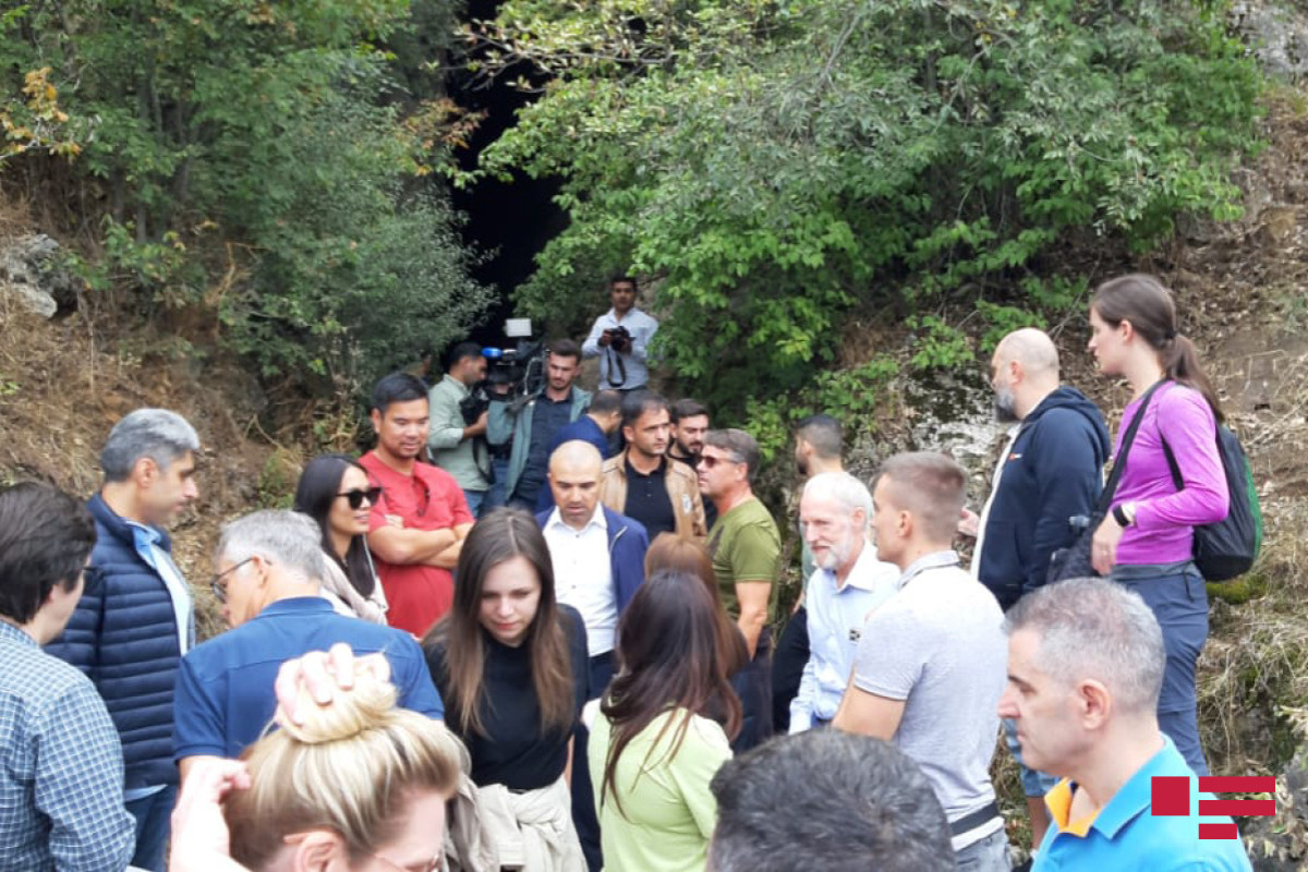International travelers visit Azykh Cave