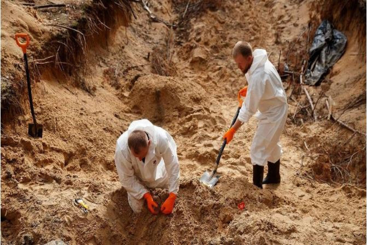 Ukraynanın İzyum şəhərində kütləvi məzarlıqdan 59 meyit ekshumasiya edilib