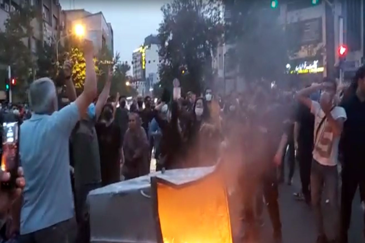 Police officer burned during protests in Iran-VIDEO -UPDATED 
