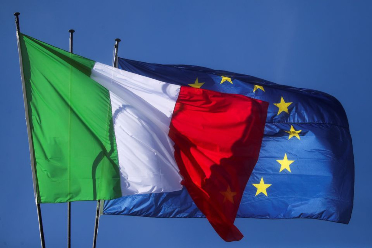EU urges Italy to stick to programme as approves more funding