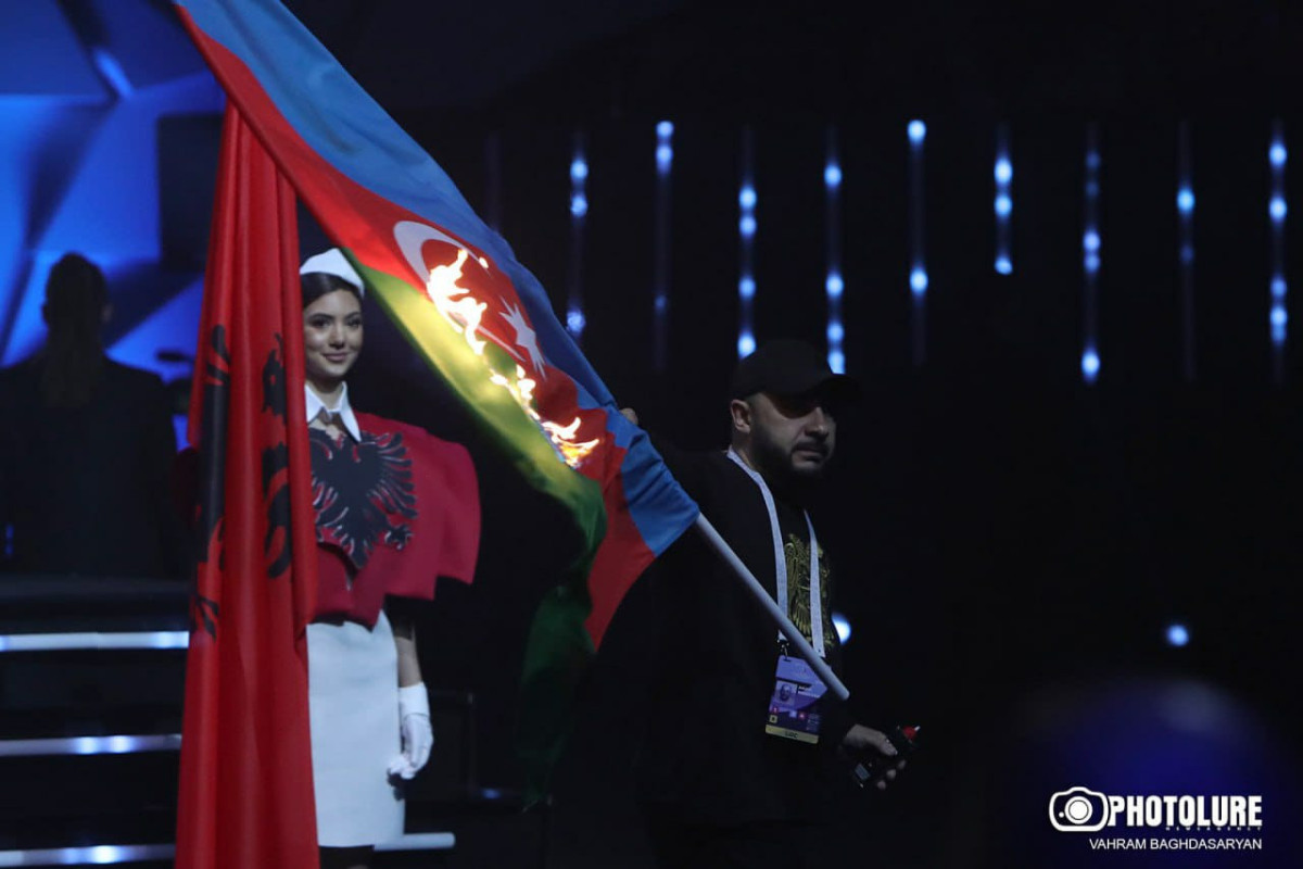 Armenian who burned Azerbaijani Flag was designer of flag bearer who dressed in Azerbaijani flag, received high fee