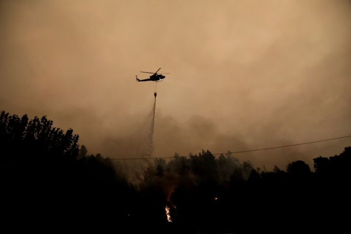 Firefighters battle dozens of wildfires in Chile, death toll at 22