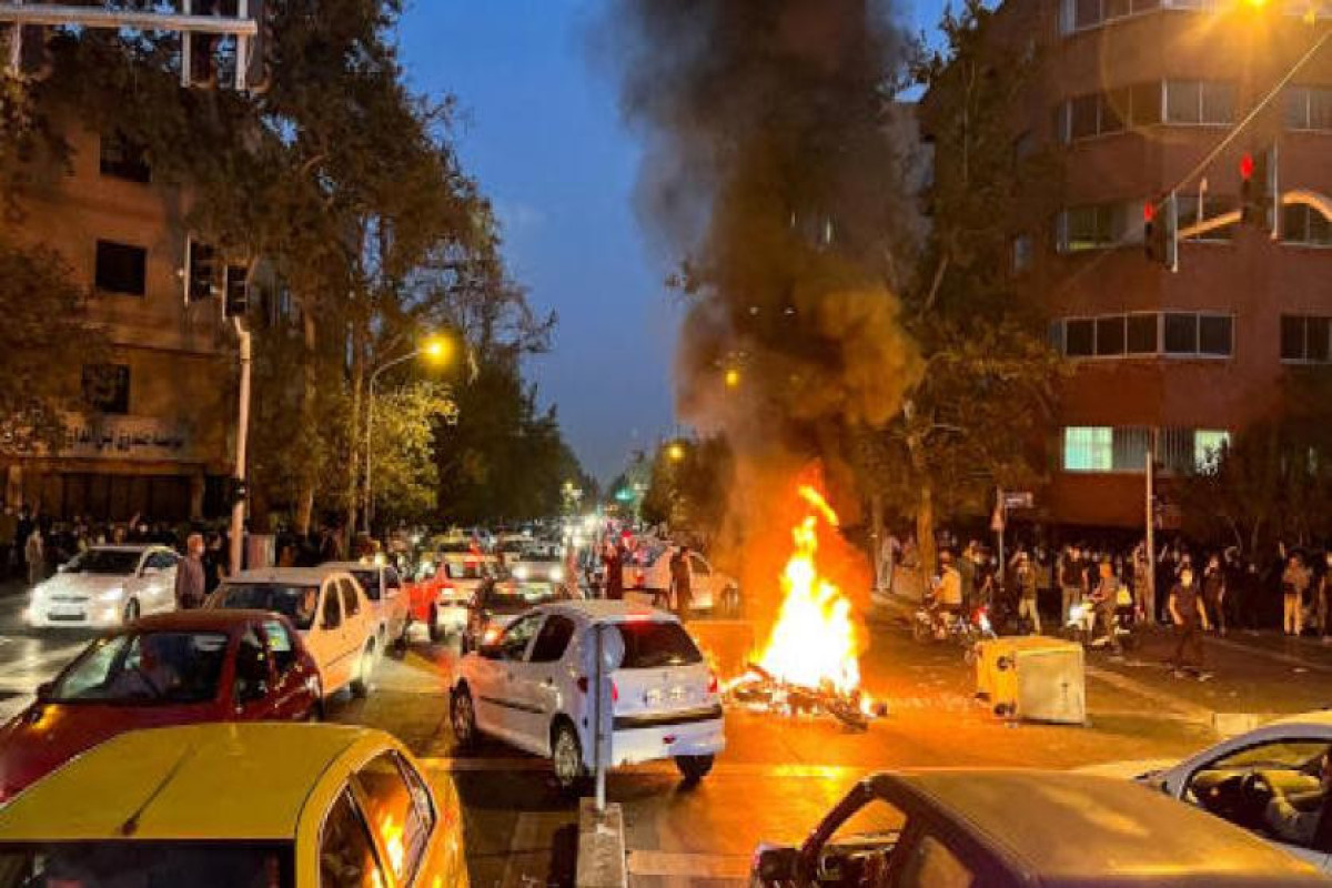 Iran hangs two men accused of killing security official during protests