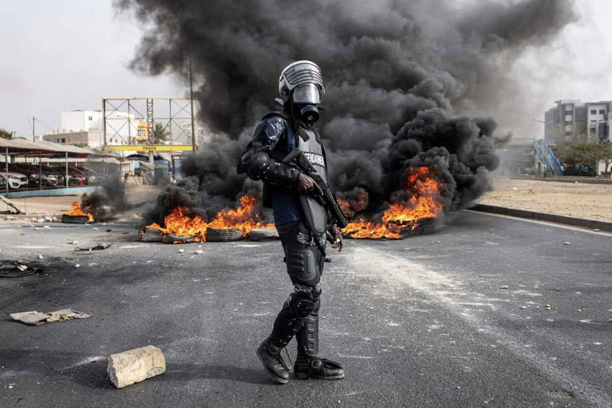 Clashes in Senegal leave at least 9 dead, government bans use of social media platforms