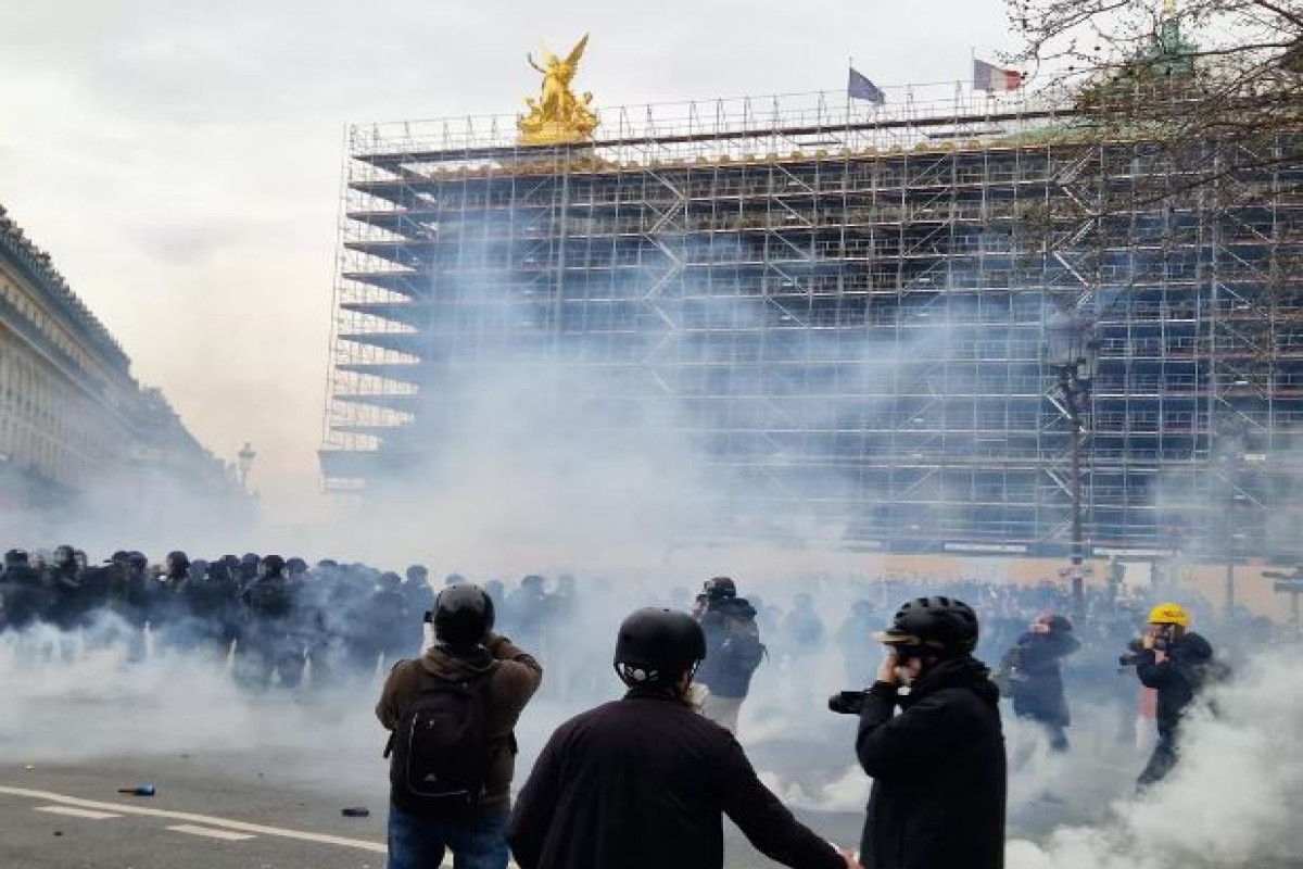 Violence hits Paris in day of protests over Macron