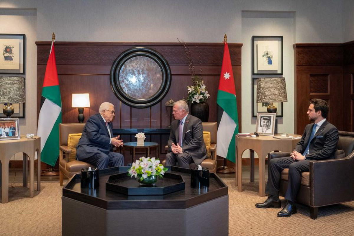 King Abdullah II (C) of Jordan meets with Palestinian President Mahmoud Abbas (L) in Amman, Jordan on Feb. 25, 2024. (Royal Hashemite Court/Handout via Xinhua)