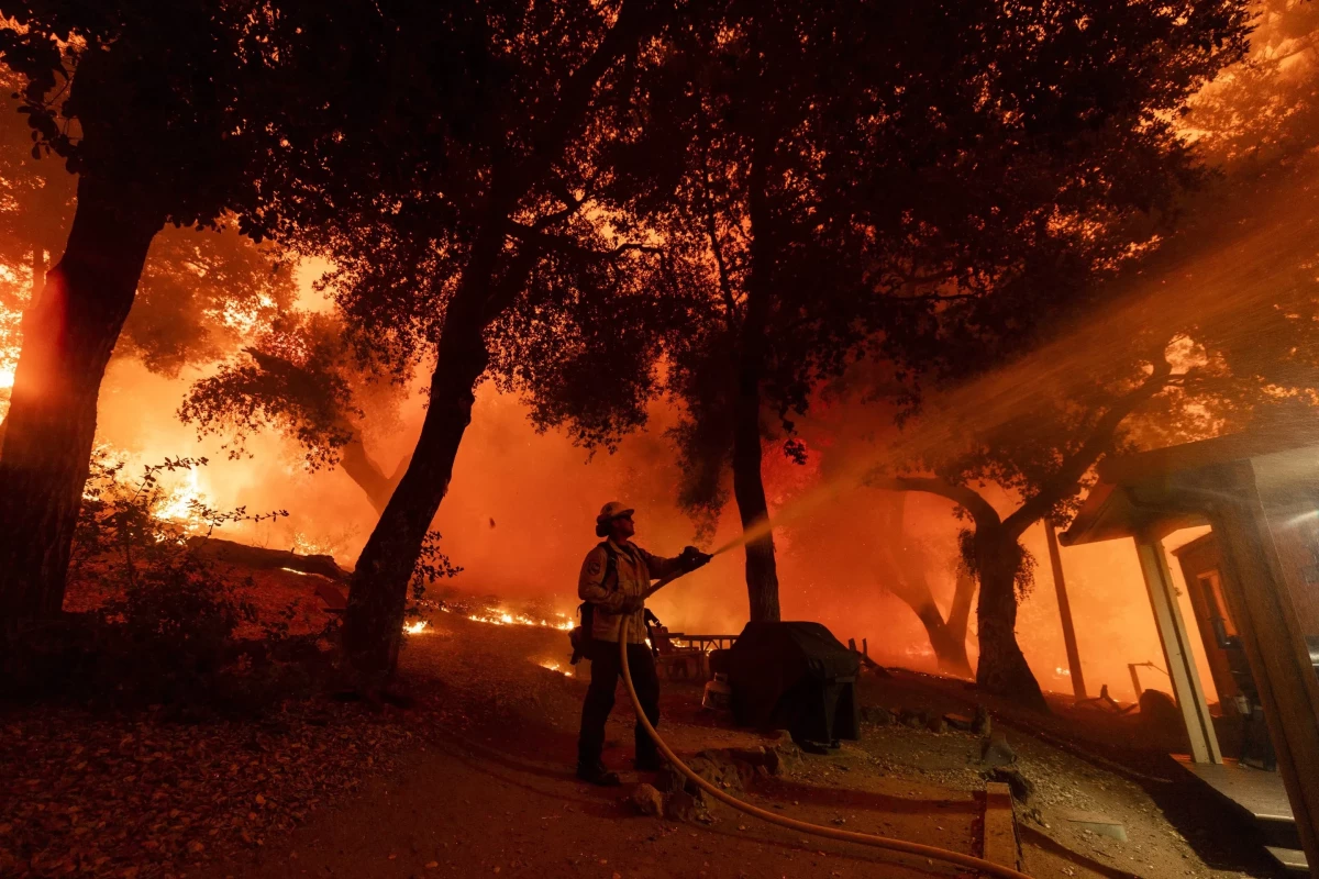 Wildfires near Spokane destroy more than 700 buildings, force 64,000 to flee