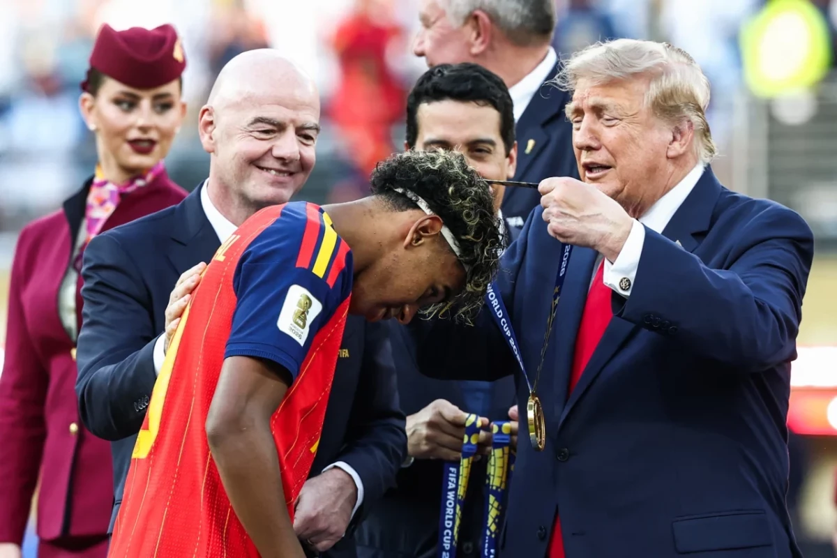 Spain receive their winner medals ahead of raising the World Cup trophy