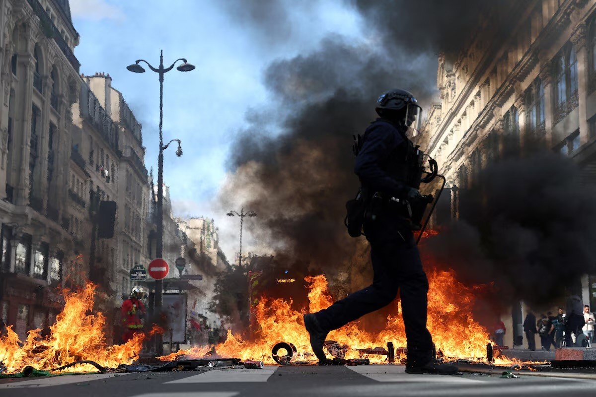 French police clash with protesters as tens of thousands rally over cost of living